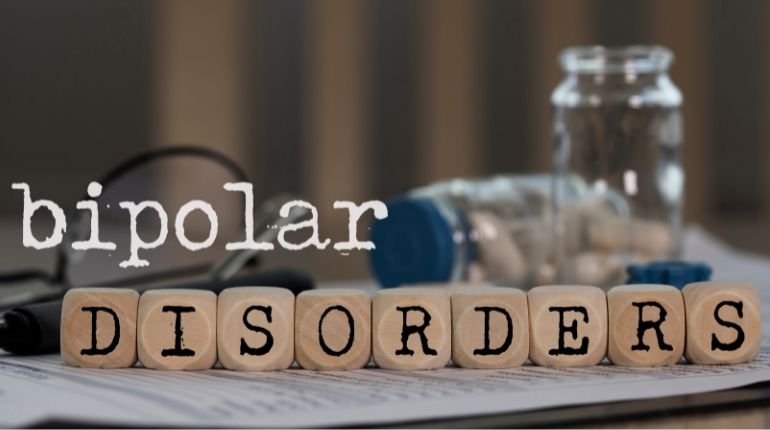 Bipolar sisorders header image with the word disorders written in wooden blocks